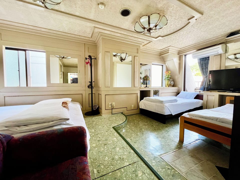 Economy Quadruple Room, Multiple Beds, Non Smoking, Private Bathroom | Blackout drapes, soundproofing, WiFi (free), bed sheets