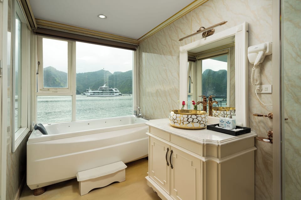 Luxury Triple Room, Balcony, Ocean View | Bathroom | Shower, hair dryer, slippers, towels