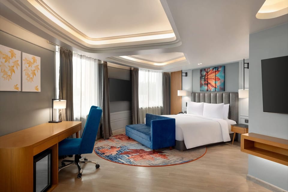 Premium Suite, 1 King Bed, City View | Hypo-allergenic bedding available, down comforters, in-room safe, desk