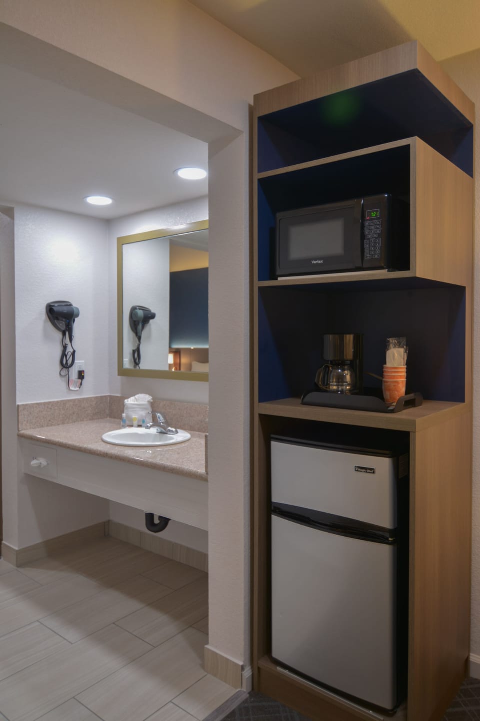 Suite, 1 King Bed, Non Smoking | Desk, laptop workspace, blackout drapes, iron/ironing board