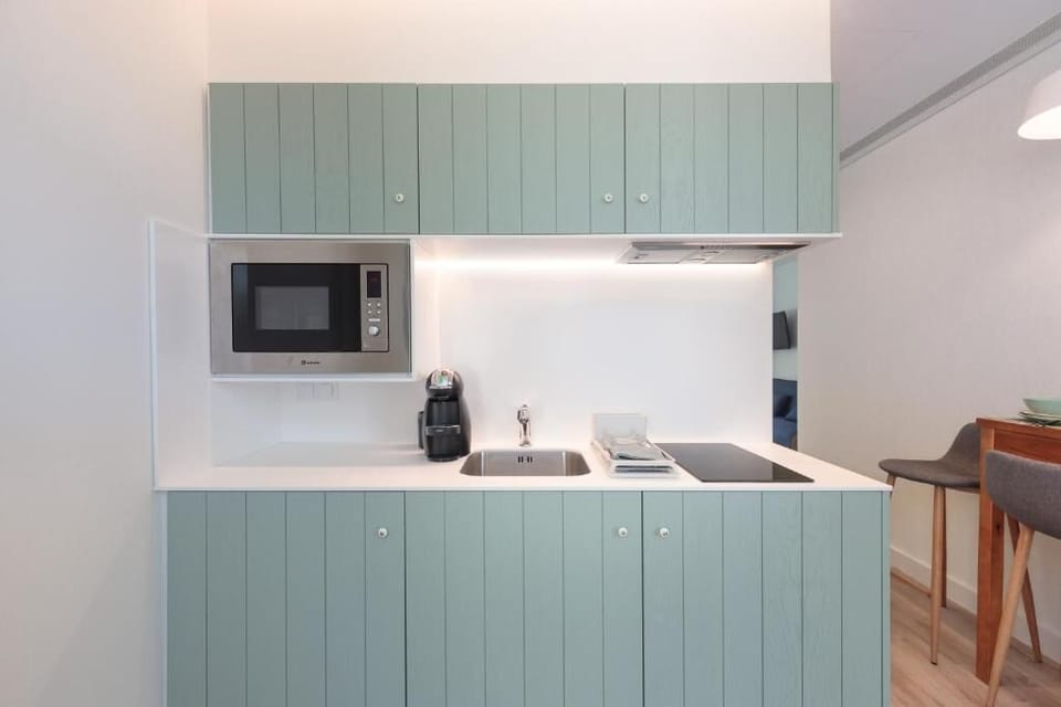 Mini-fridge, microwave, stovetop, cookware/dishes/utensils