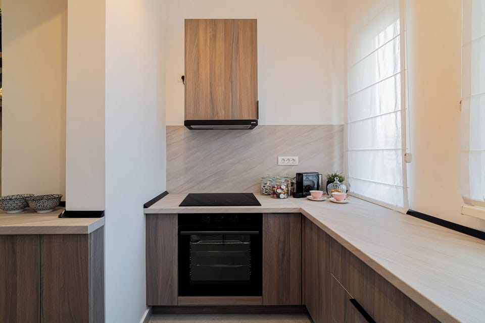 Deluxe Apartment, 4 Bedrooms, Balcony, City View | Private kitchen | Coffee/tea maker, electric kettle