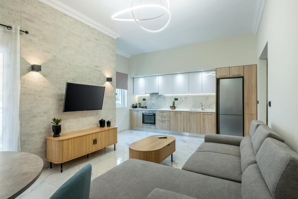 Luxury Apartment, City View | Living area | 43-inch Smart TV with cable channels