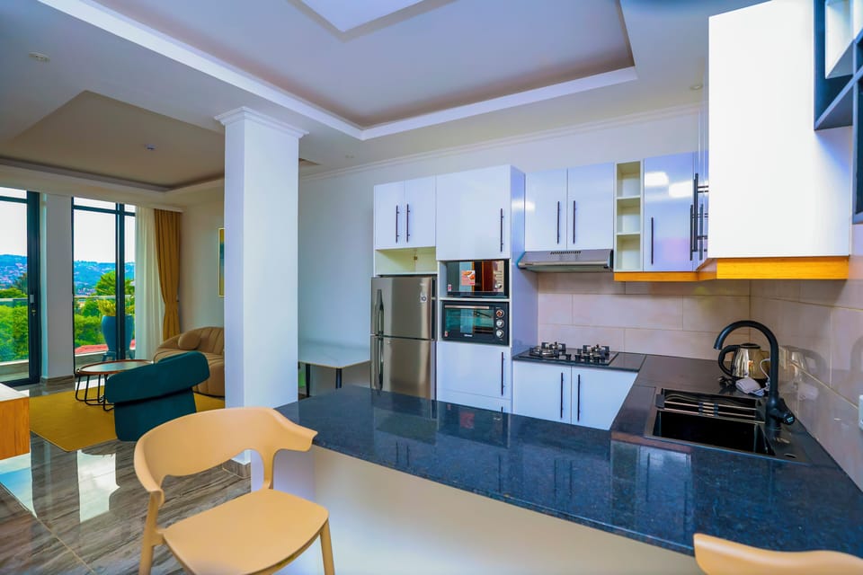 Luxury Apartment, Balcony, City View | Private kitchen | Full-size fridge, oven, stovetop, dishwasher