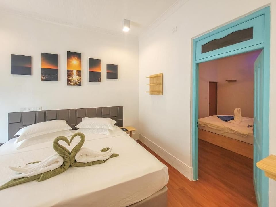 Deluxe Quadruple Room, Balcony, Garden View | In-room safe, iron/ironing board, free WiFi