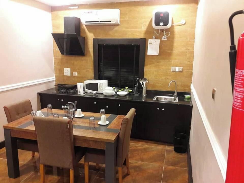 Economy Apartment, Balcony, City View | Private kitchen | Fridge, microwave, oven, stovetop