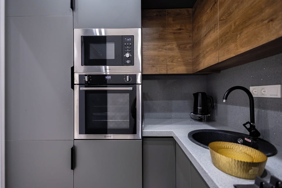 Family Condo, City View | Private kitchen | Stovetop, electric kettle