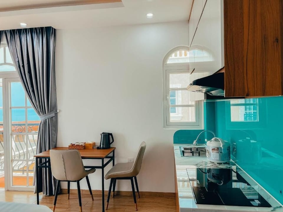 Deluxe Studio, Balcony, Beach View | Living area | 25-inch TV with cable channels