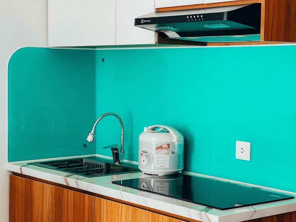 Deluxe Quadruple Room, City View | Private kitchen | Mini-fridge