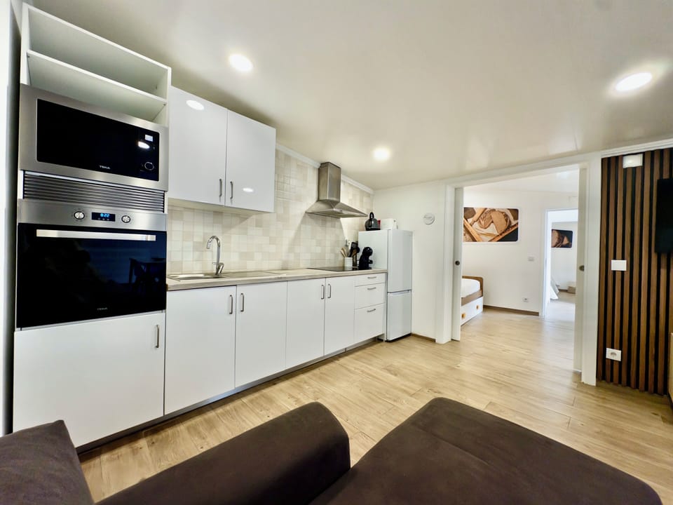 Comfort Townhome | Private kitchen | Espresso maker, full-size fridge, microwave, oven
