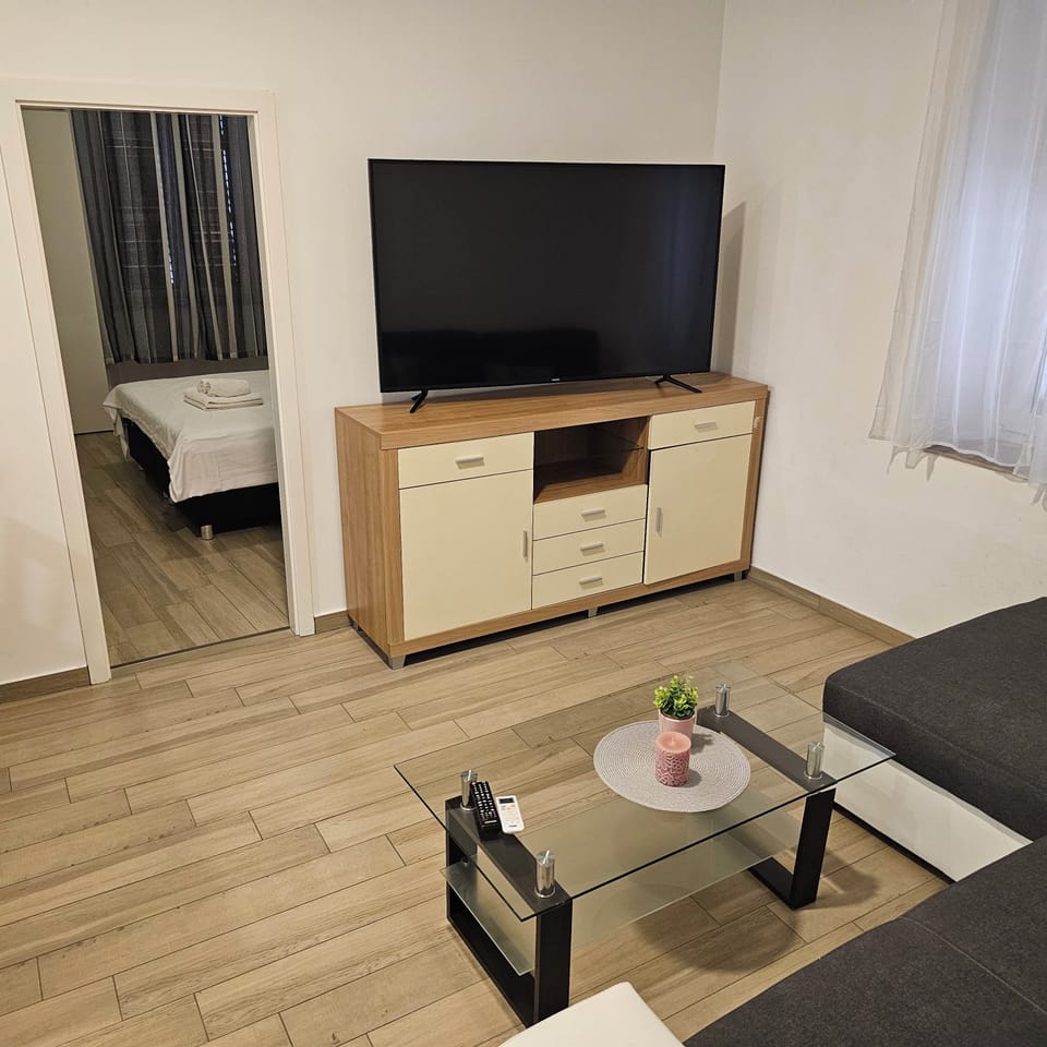 Comfort Apartment, 2 Bedrooms | Living area | Flat-screen TV