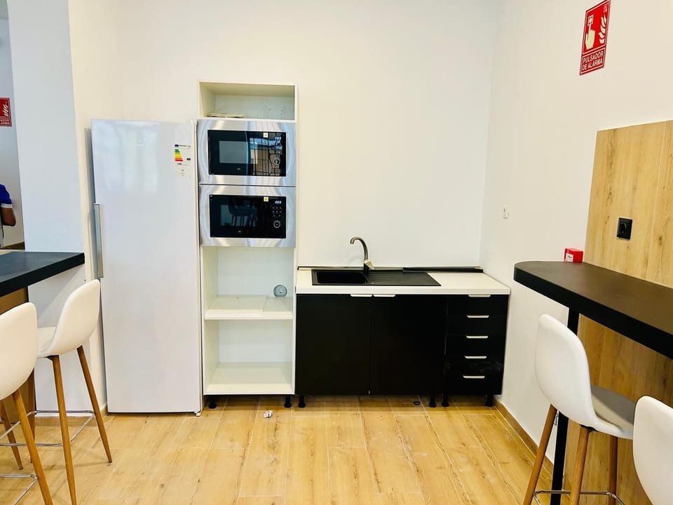 Shared fridge, shared microwave, toaster, cookware/dishes/utensils