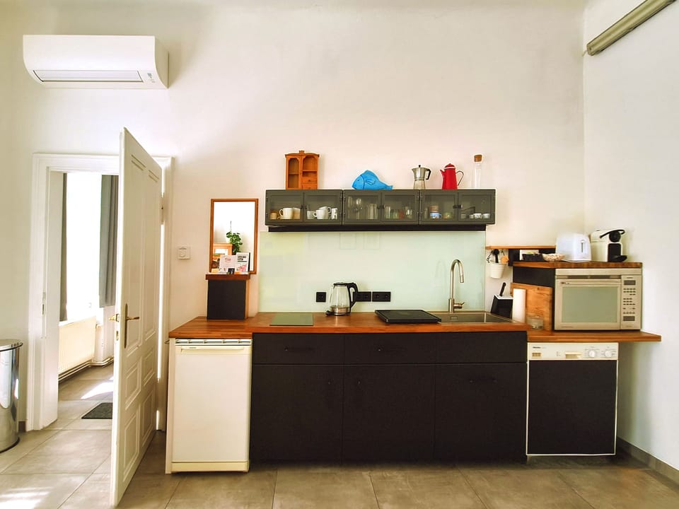 Apartment, Courtyard View | Private kitchen | Espresso maker, coffee/tea maker, full-size fridge, microwave
