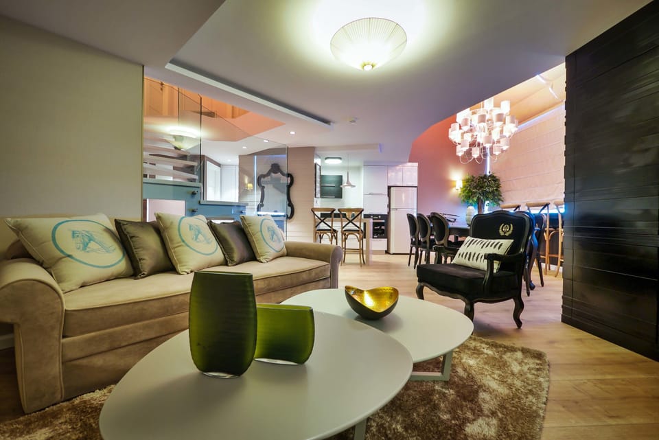 Presidential Duplex, 2 Bedrooms (suite) | Living room | 35-inch LCD TV with cable channels, TV, video-game console