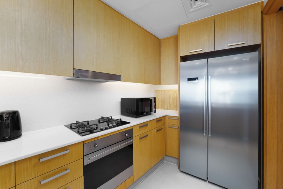 Deluxe Apartment, 2 Bedrooms, Balcony | Private kitchen | Coffee/tea maker, electric kettle