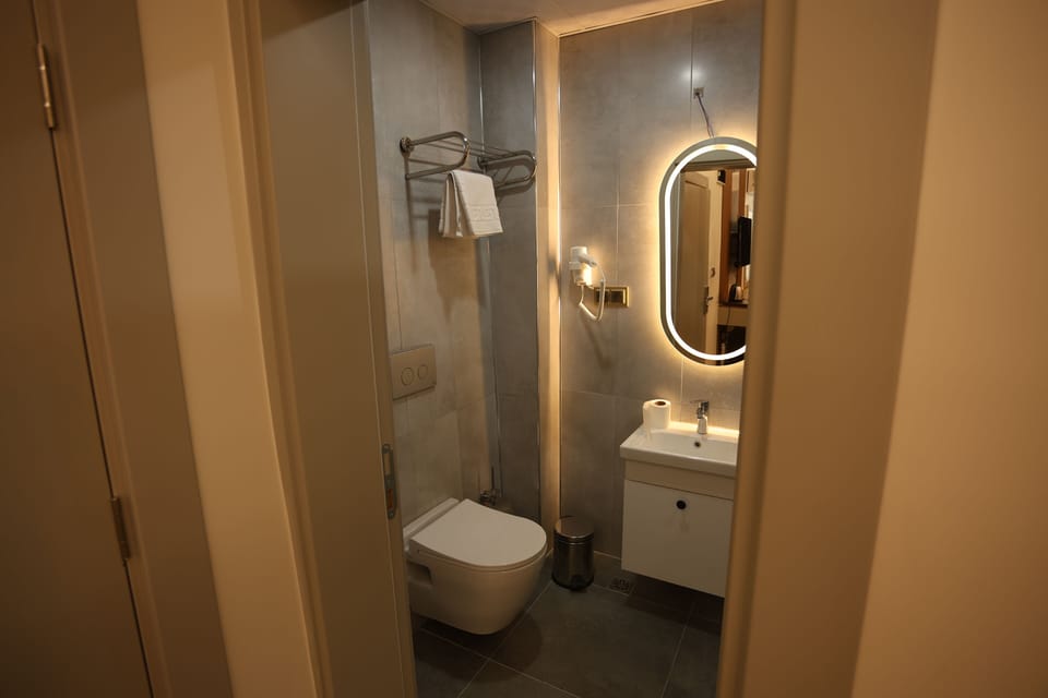 Shower, free toiletries, hair dryer, slippers