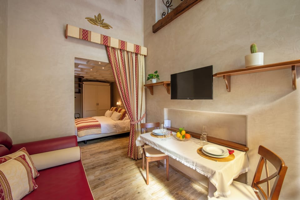 Luxury Apartment, Multiple Beds, Garden View | Living area | 33-inch LED TV with satellite channels, TV