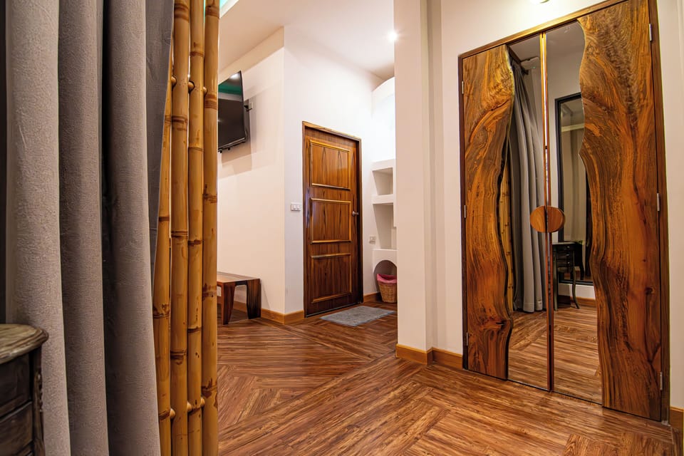 Deluxe King Room Pool View | Free minibar, in-room safe, individually decorated, desk