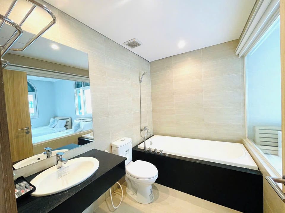 Family Quadruple Room, Garden View | Bathroom | Rainfall showerhead, free toiletries, hair dryer, bidet