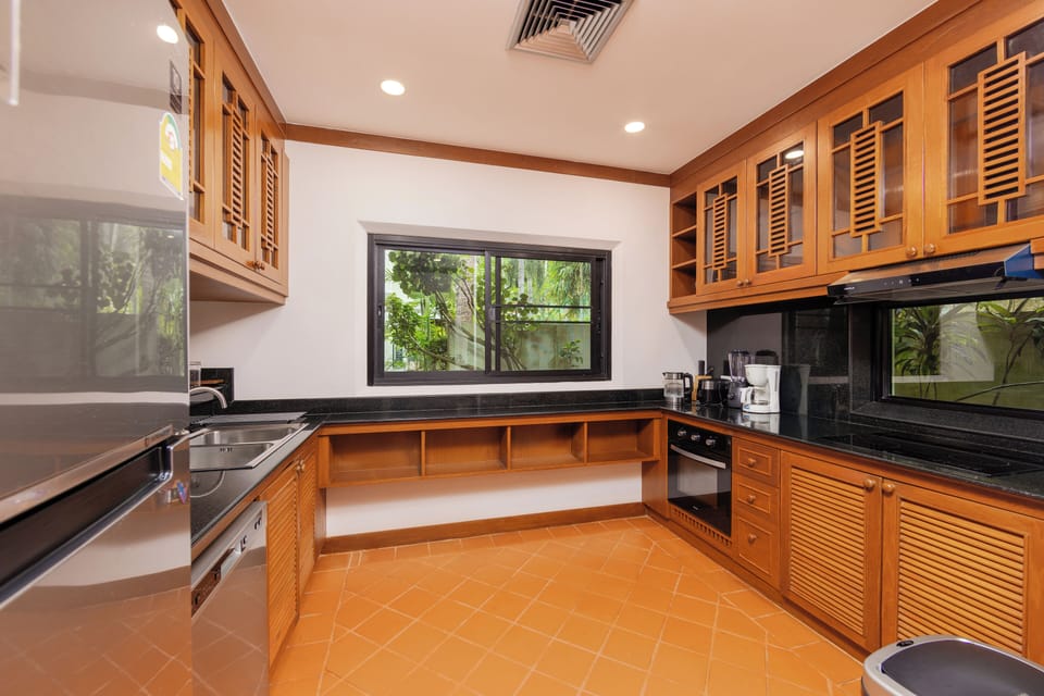 Family Villa, Lanai, Pool View | Private kitchen | Coffee/tea maker, electric kettle, highchair