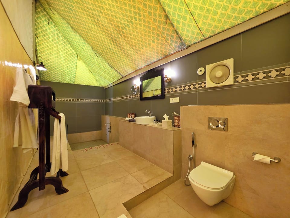 Luxury Suite, Garden View | Bathroom | Separate tub and shower, hair dryer, towels, soap