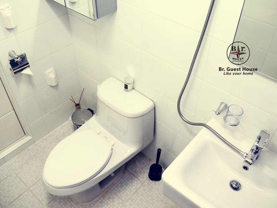 Shower, hair dryer, slippers, towels