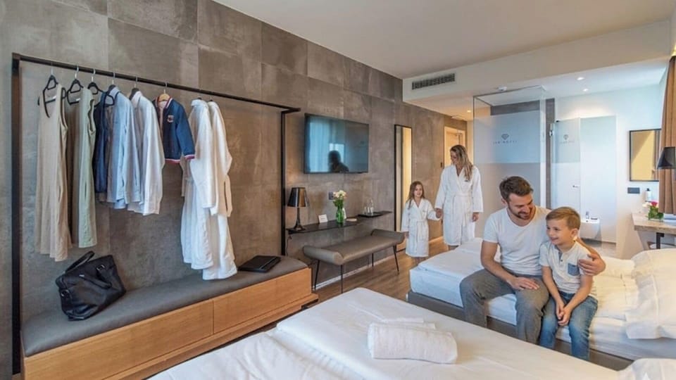Family Room | Premium bedding, down comforters, memory foam beds, minibar
