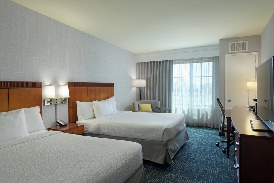 Premium bedding, down comforters, pillowtop beds, in-room safe