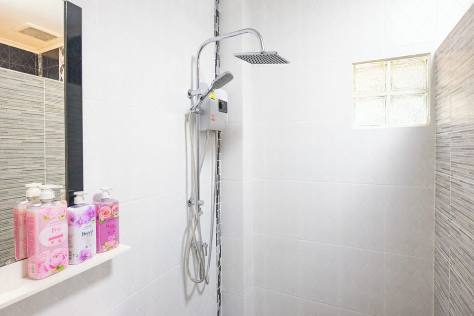 Family Room, 1 King Bed with Sofa bed, Non Smoking, Pool View | Bathroom | Shower, free toiletries, hair dryer, towels