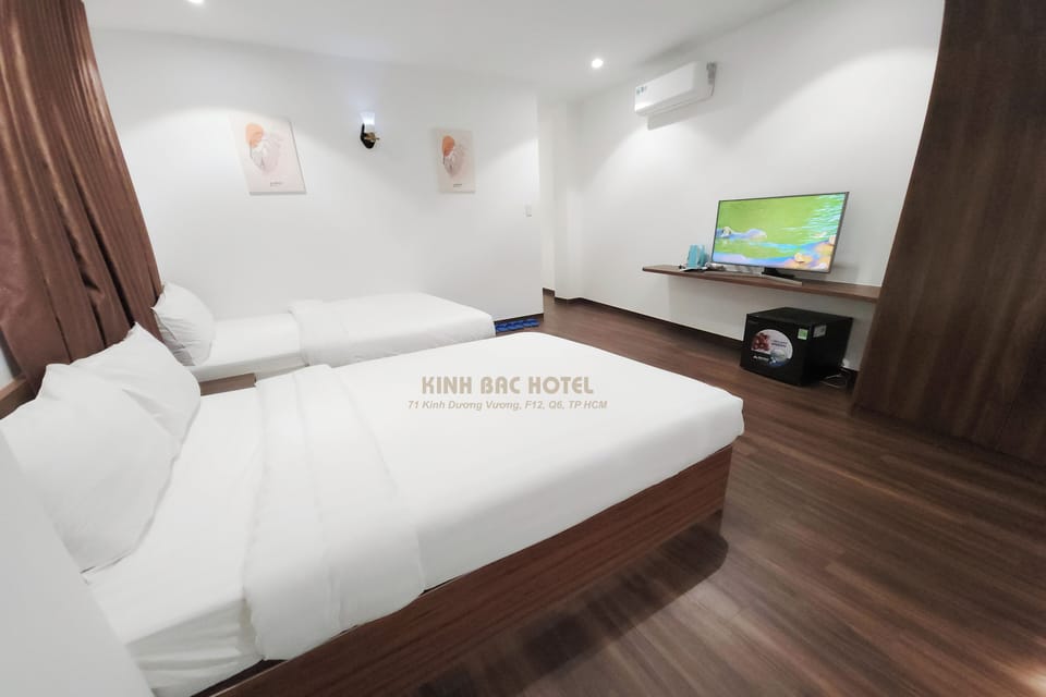 Deluxe Quadruple Room, Private Bathroom, City View | Blackout drapes, free WiFi, bed sheets