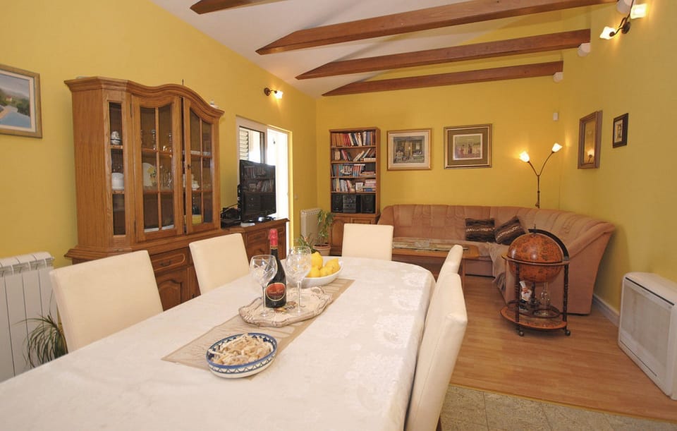 House (Four Bedroom Holiday Home with Sauna ) | Living room | 32-inch flat-screen TV with cable channels