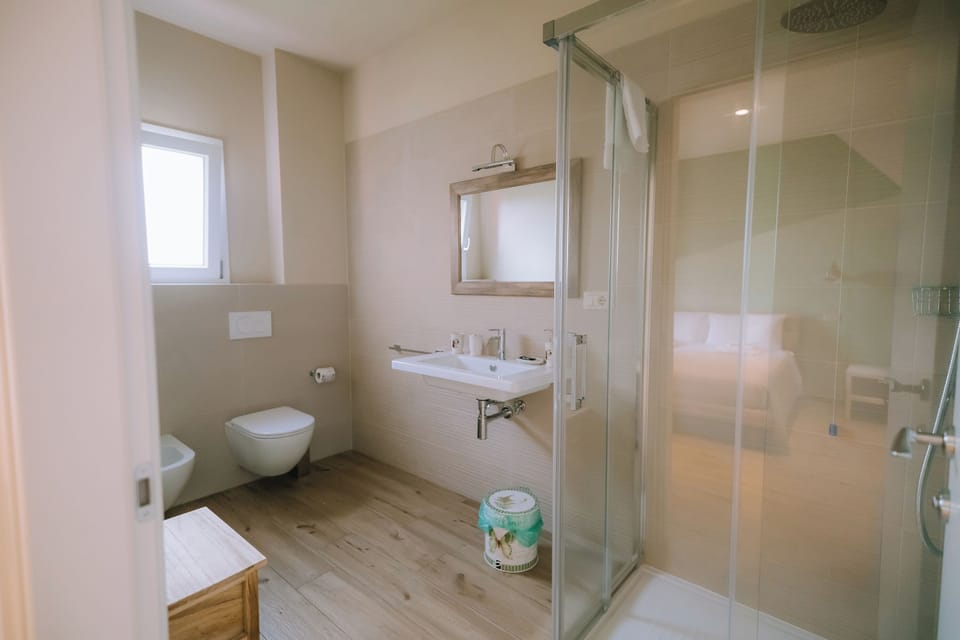 Quadruple Room | Bathroom | Shower, hair dryer, towels, soap