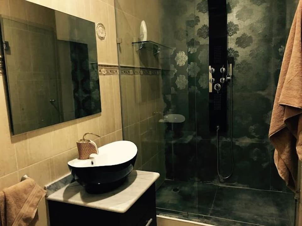 Family Room, Balcony, City View | Bathroom | Hair dryer