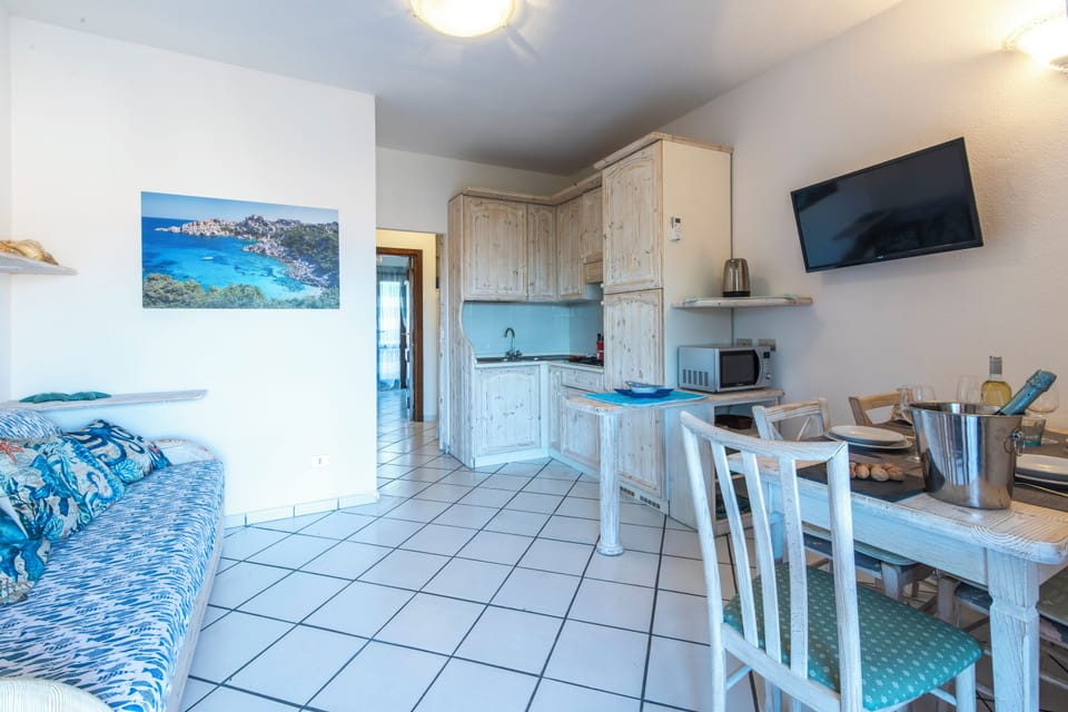 Family Apartment, 1 Bedroom, Microwave (Sandy Bear Guesthouse) | Living area | Flat-screen TV