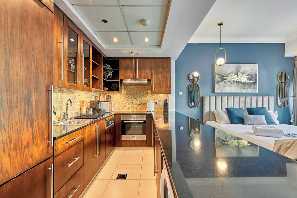 Premium Studio, 1 King Bed, City View | Private kitchen | Fridge, microwave, oven, dishwasher