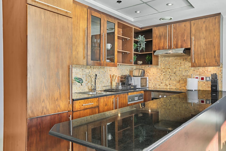 Premium Studio, 1 King Bed, City View | Private kitchen | Fridge, microwave, oven, dishwasher
