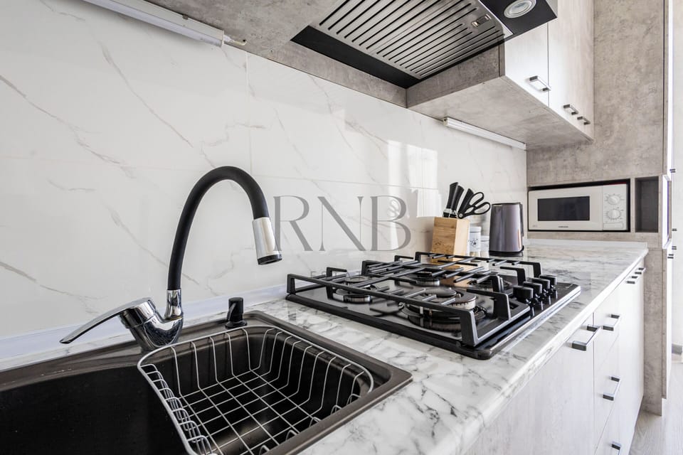 Family Condo, Balcony, City View | Private kitchen | Electric kettle