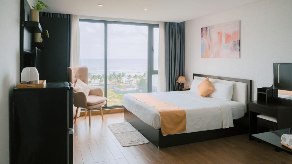 Deluxe Double Room, Beach View | In-room safe, blackout drapes, WiFi (free), bed sheets
