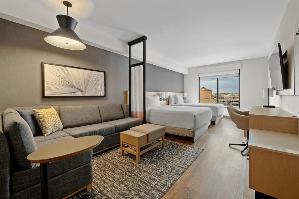 Room, Multiple Beds | Down comforters, in-room safe, desk, blackout drapes