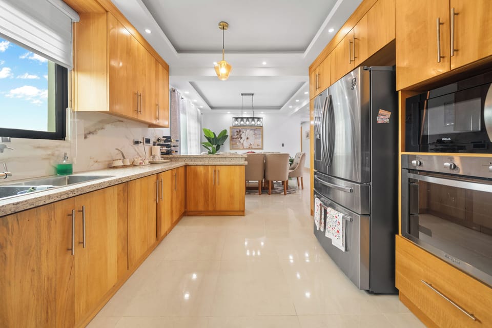 Family Condo, Garden View | Private kitchen | Fridge, microwave, oven, stovetop