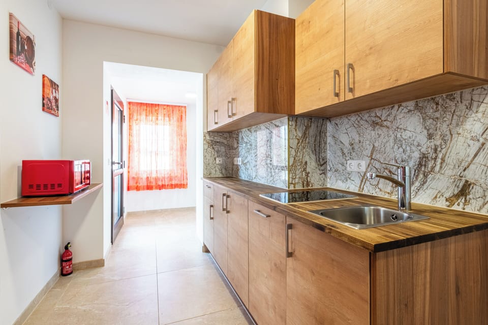 Basic Apartment | Living area | Flat-screen TV