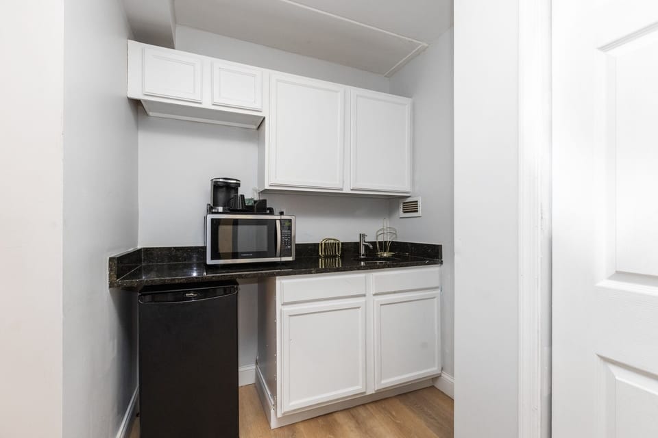 Junior Suite, 1 King Bed | Private kitchenette | Microwave, coffee/tea maker, highchair