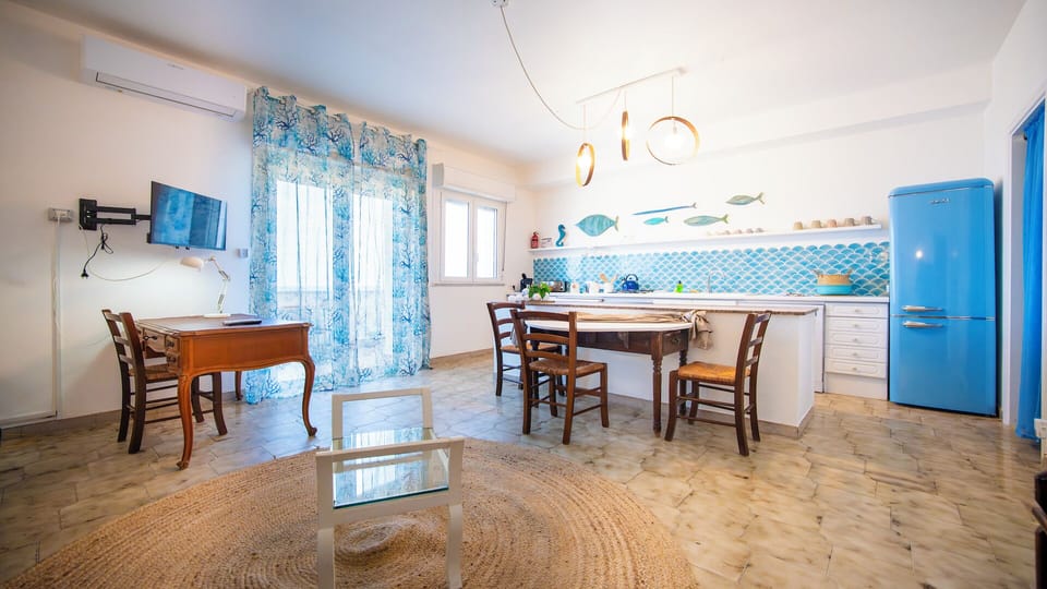 Apartment, Balcony, Sea View | Living area | 32-inch flat-screen TV with cable channels