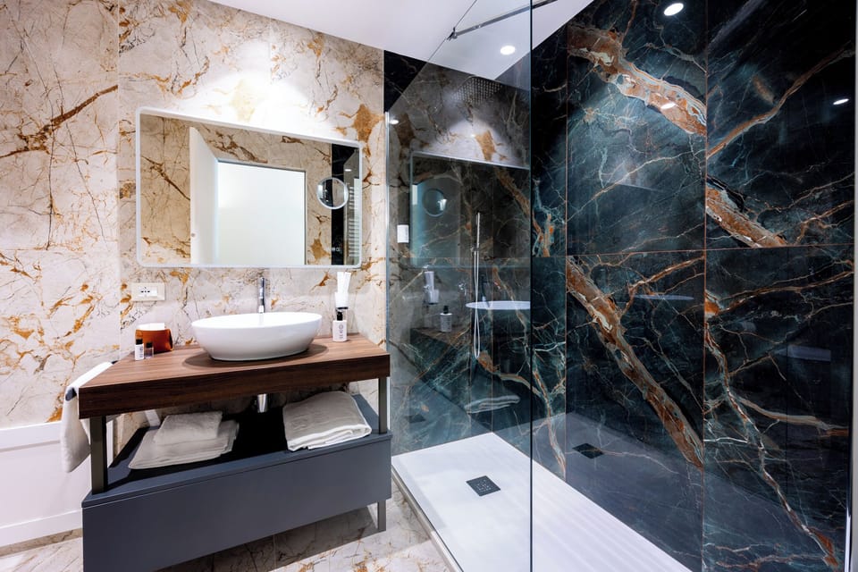 Luxury Suite, Balcony, City View | Bathroom | Shower, hair dryer, bathrobes, slippers
