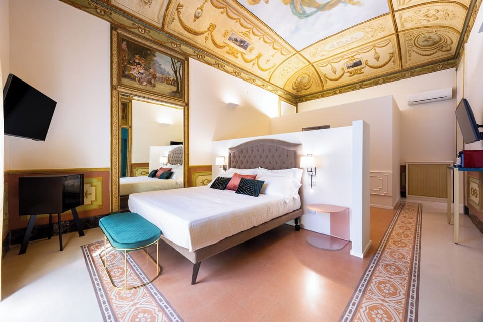 Deluxe Suite, Balcony, City View | Minibar, in-room safe, individually furnished, desk