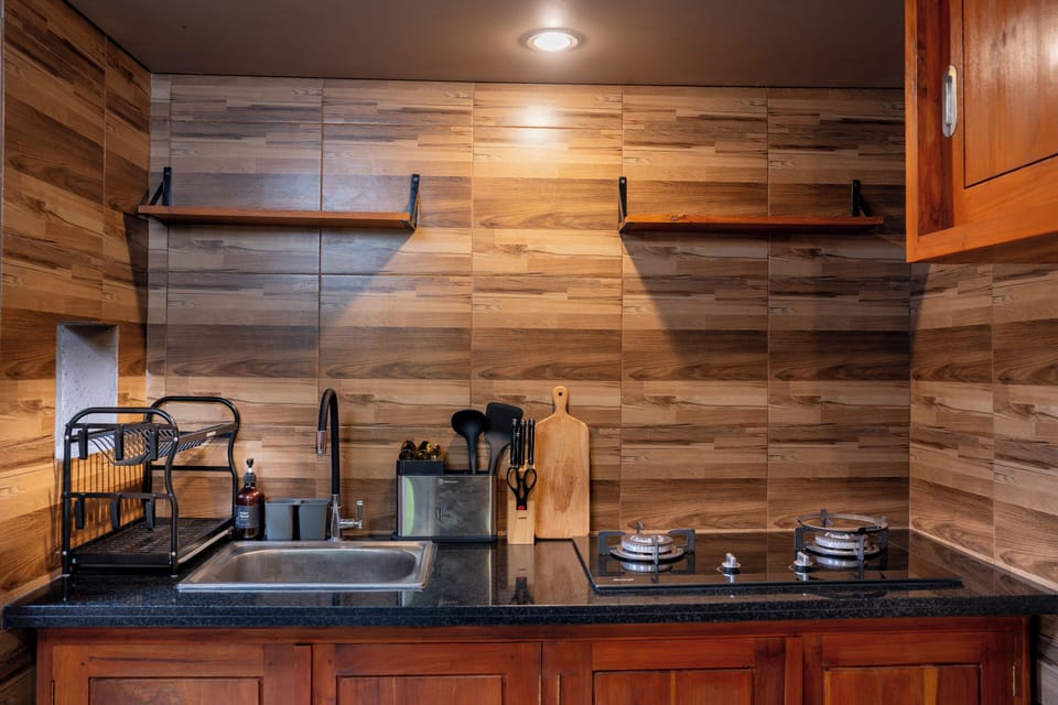 Luxury Villa, Patio, Garden View | Private kitchen | Mini-fridge, stovetop, cookware/dishes/utensils, dining tables