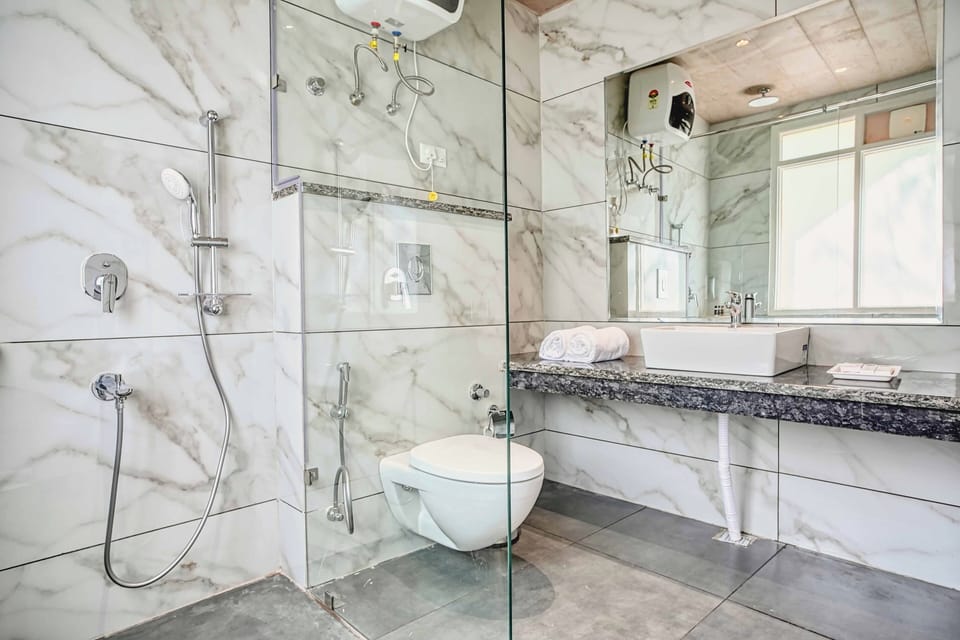 Shower, hair dryer, bathrobes, towels