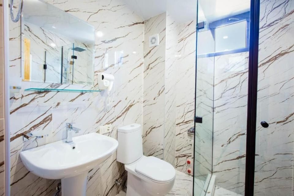 Shower, hair dryer, slippers, towels