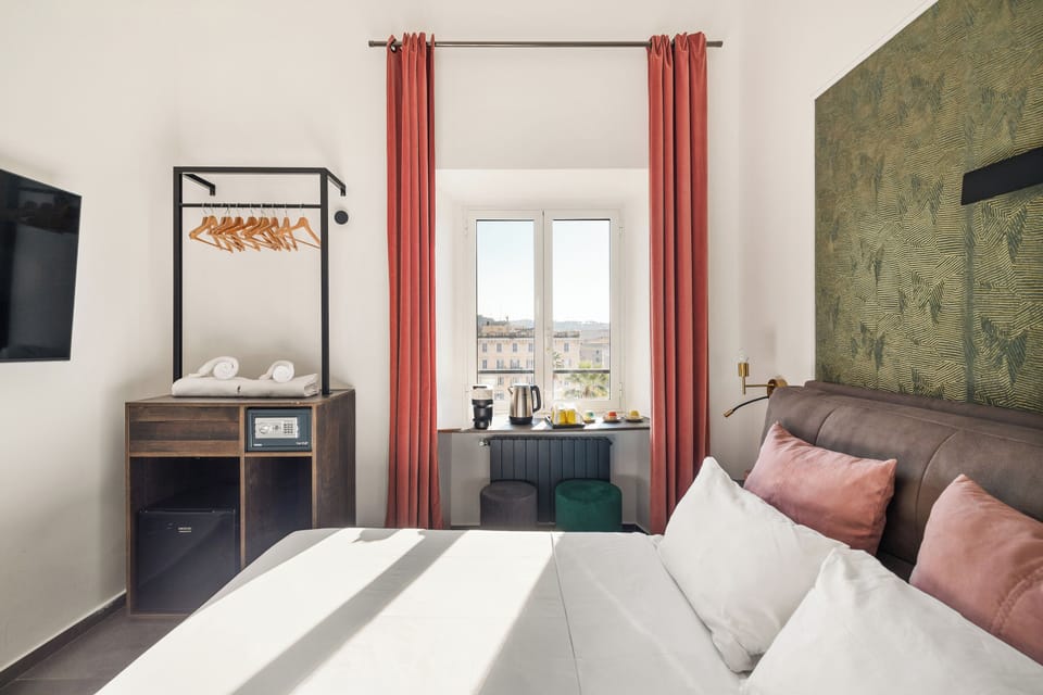 Triple Room, Private Bathroom, City View | In-room safe, blackout drapes, soundproofing, iron/ironing board