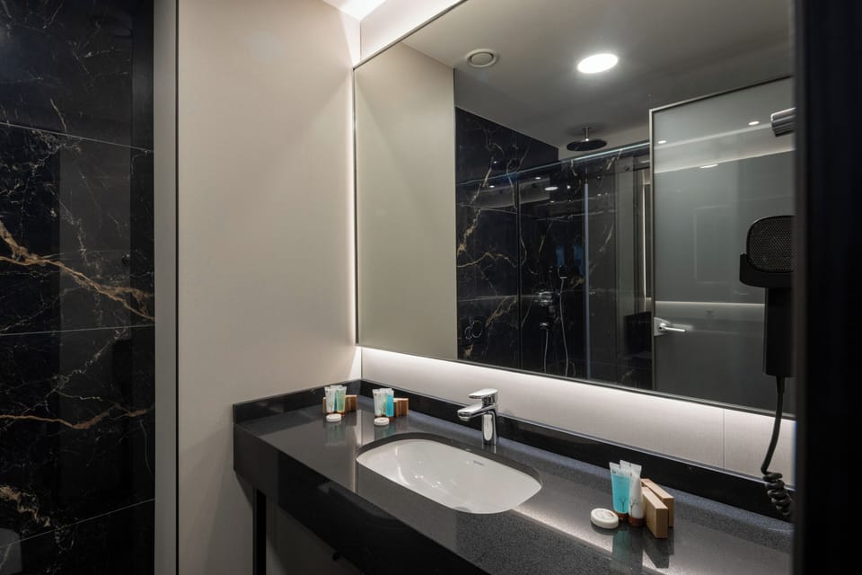 Shower, free toiletries, hair dryer, slippers
